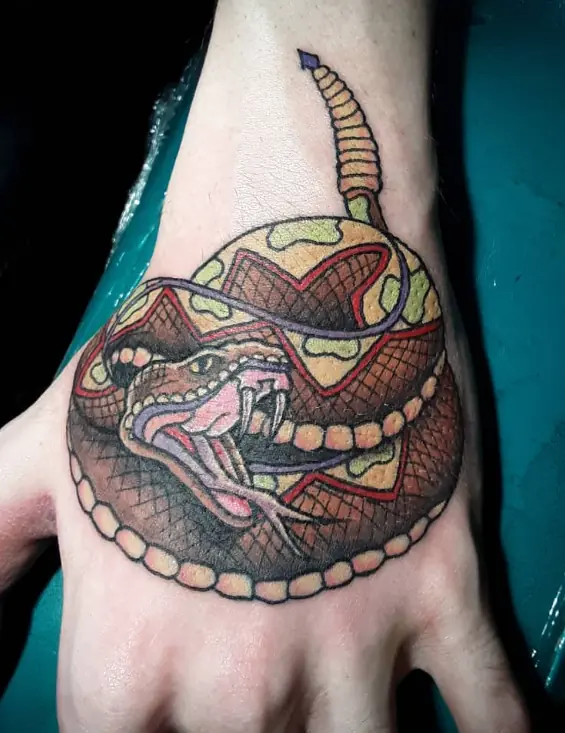 Color samurai mask tattoo on the hand