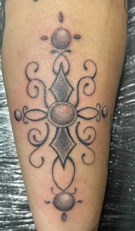 Fine-line geometric ornamental tattoo
